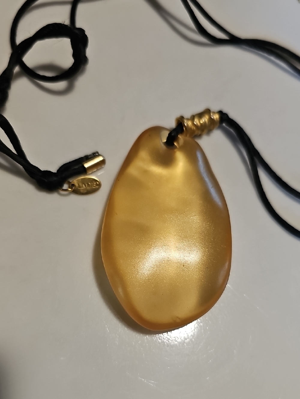 Golden Pebble Pendant Necklace with Black Cord